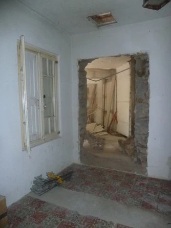 Percement de mur en pierre et cuve beton à Bompas